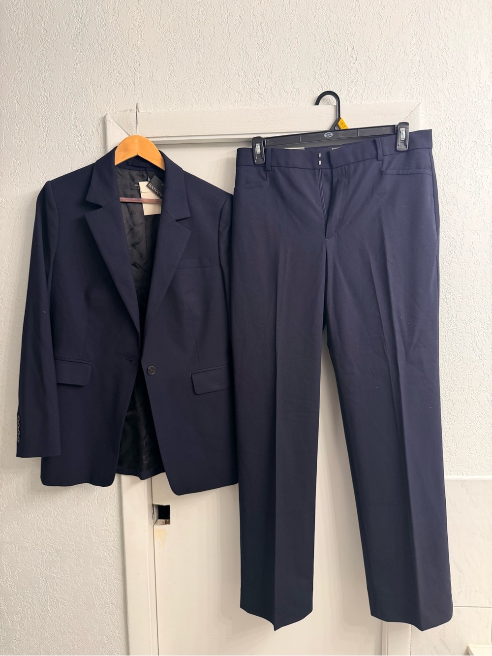 Navy blue women, two piece suit, jacket, and trouser